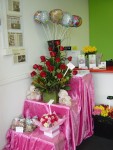 A dozen red roses in a beautiful arrangement at the entrance to our new florist in Killarney Vale